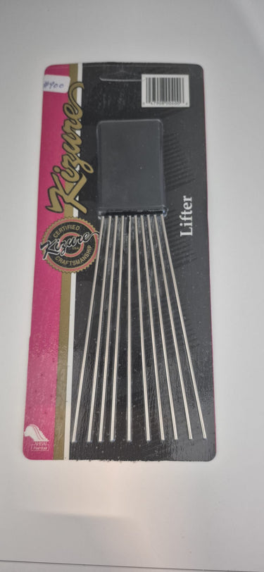Black comb on a pink and black card with a visible brand logo.